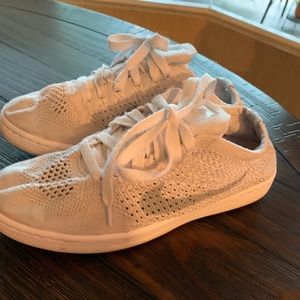 Women’s white Nike sneakers